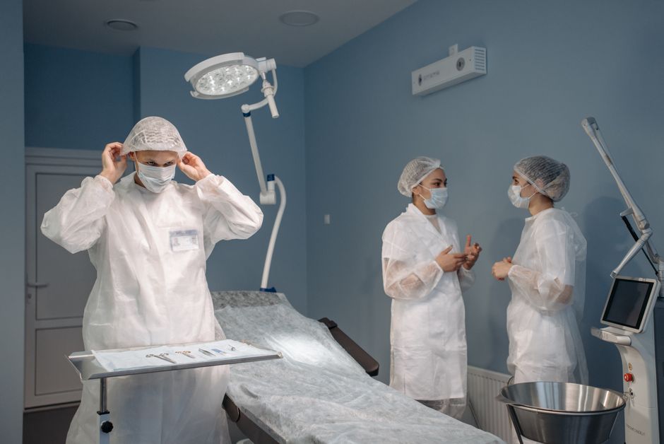 Procurement team reviewing technical specifications and test reports for antimicrobial medical casework compliance