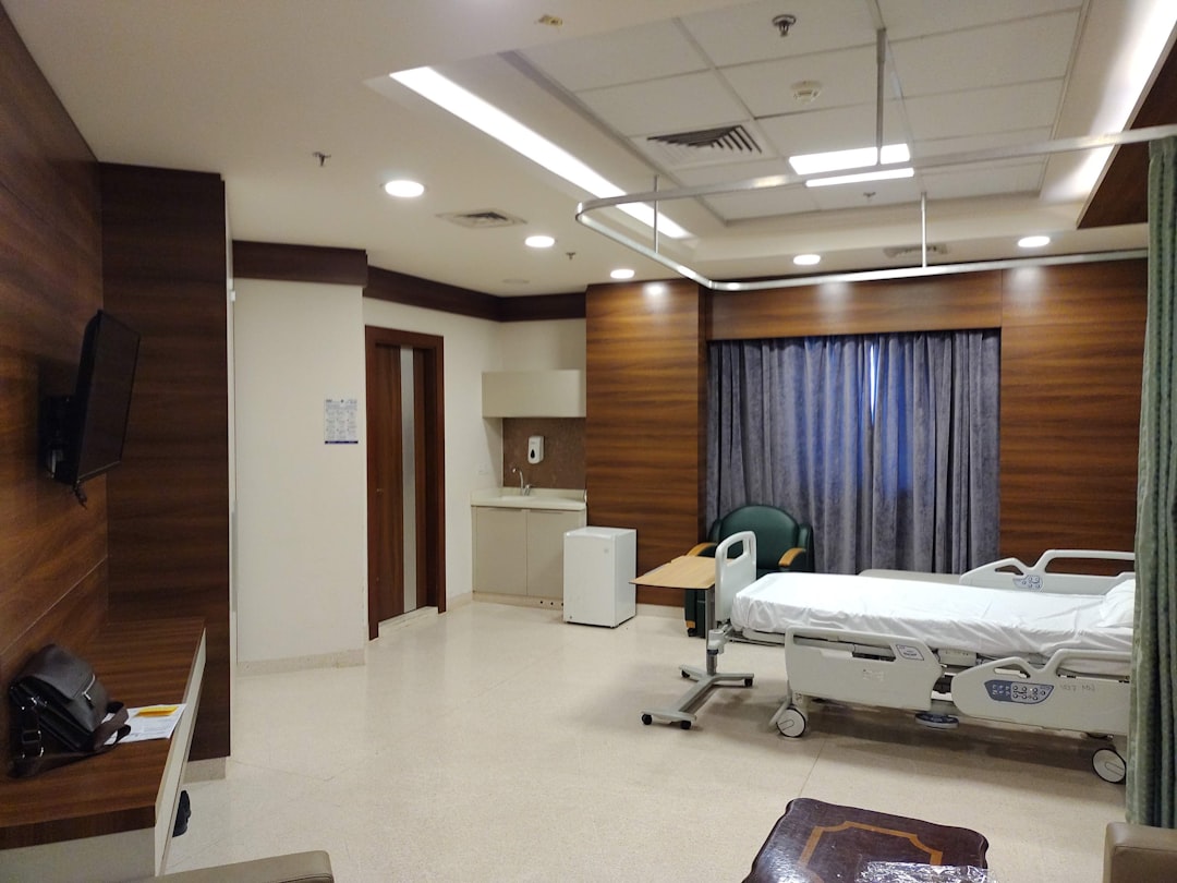Factory quality inspector reviewing batch traceability documents in a hospital furniture plant
