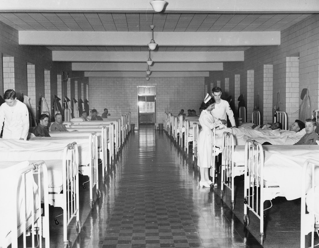 Factory worker inspecting medical furniture with CE certificate on wall