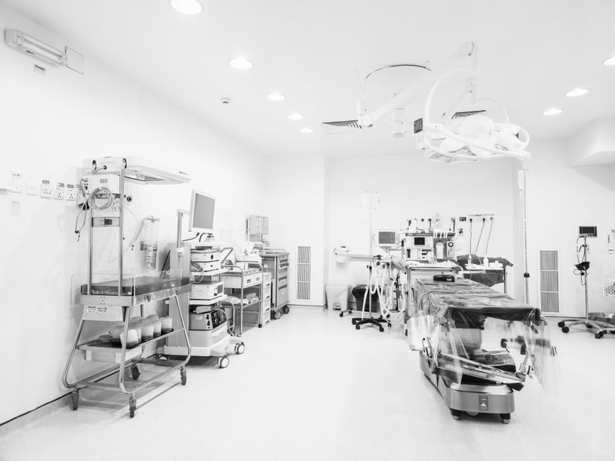 Ligature-resistant hospital furniture in a medical psychiatry unit, with anti-ligature hinges and rounded edges